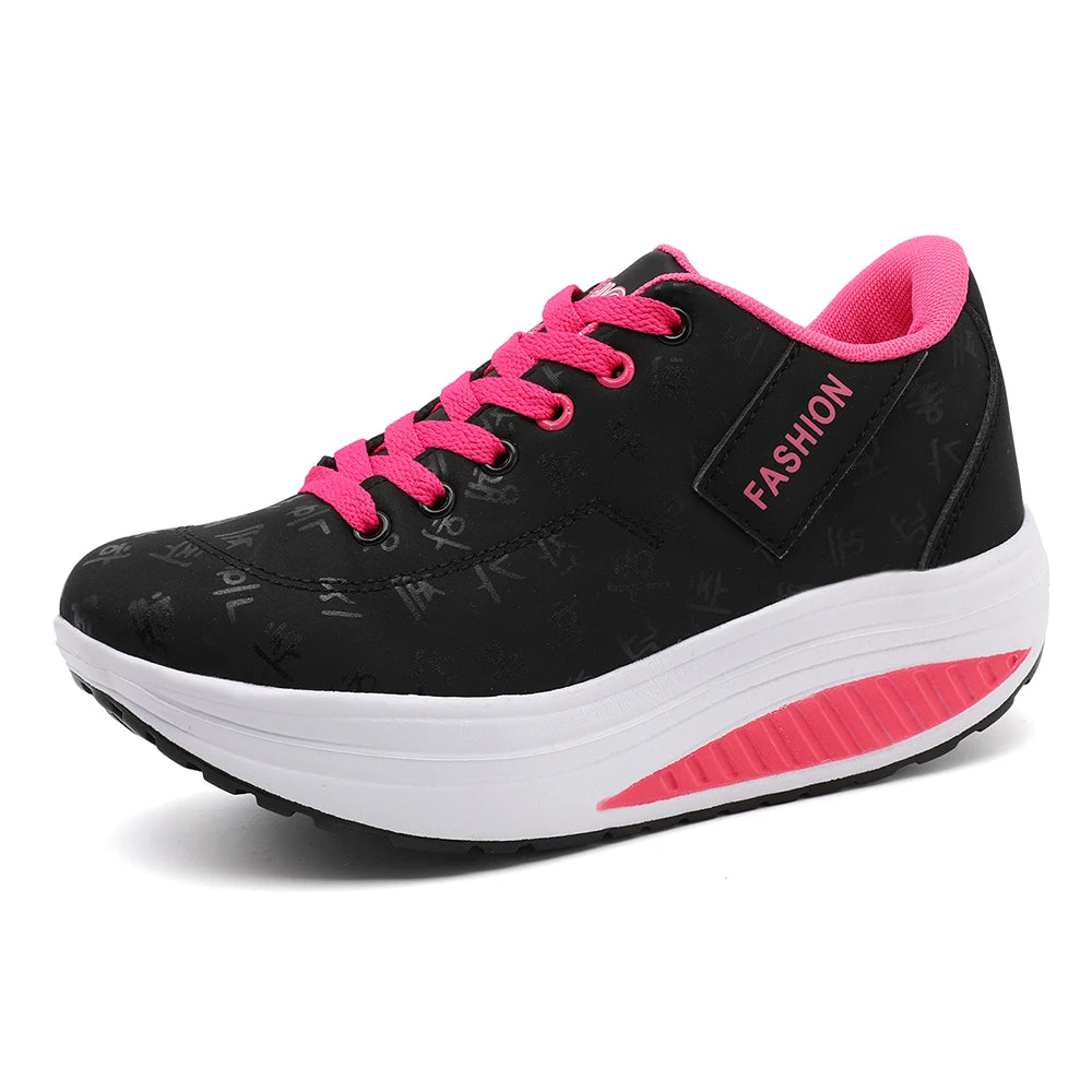 Black sneaker with pink accents on a white background