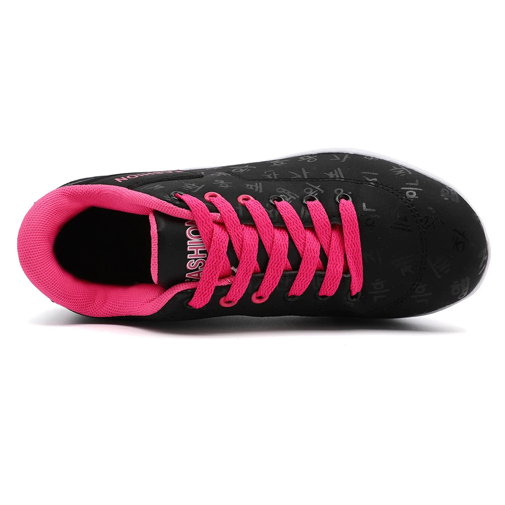 Black and pink sneaker with visible brand logo on a white background