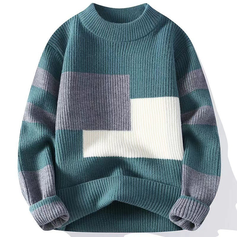 Color-blocked sweater with geometric pattern on a white background