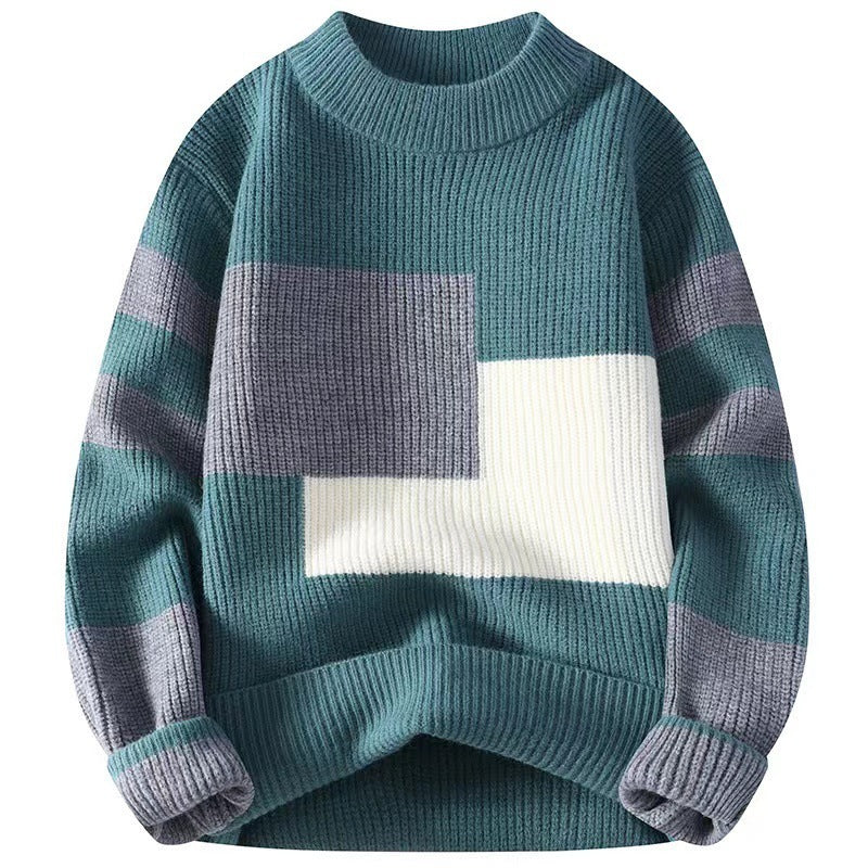 Color-blocked sweater with geometric pattern on a white background