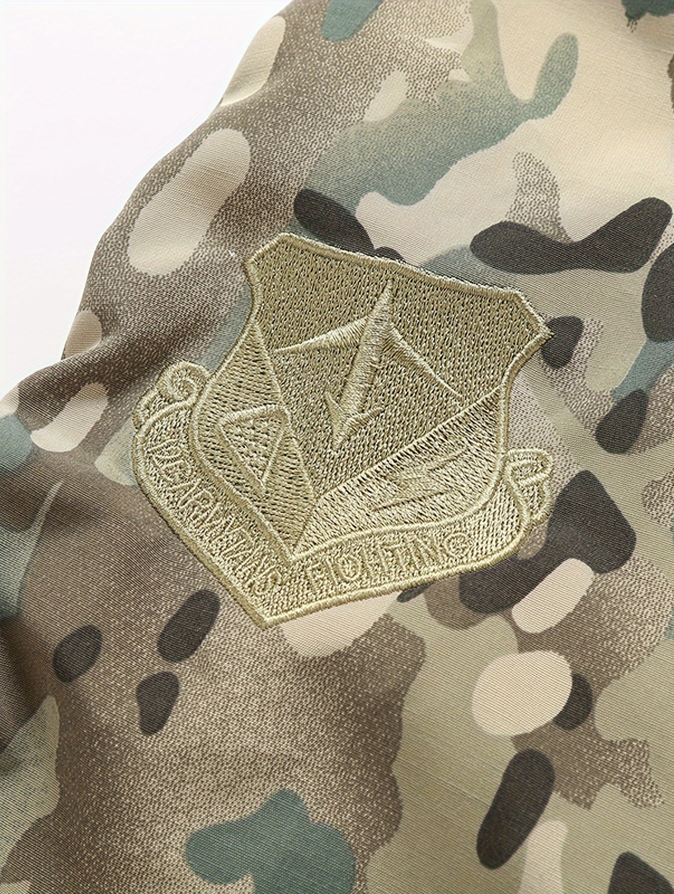 Military patch on a camouflage fabric background
