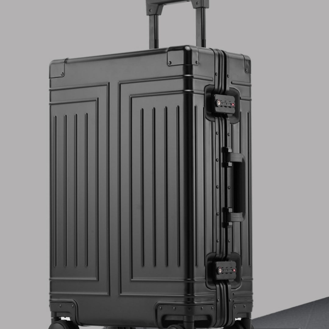 Black suitcase with a textured surface on a gray background