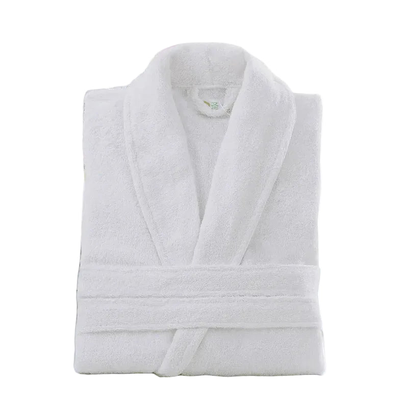 White bathrobe on a wooden surface with a blurred background