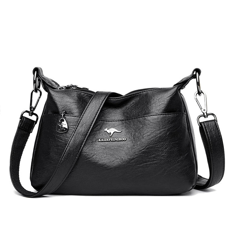 Black leather handbag with a visible brand logo on a white background