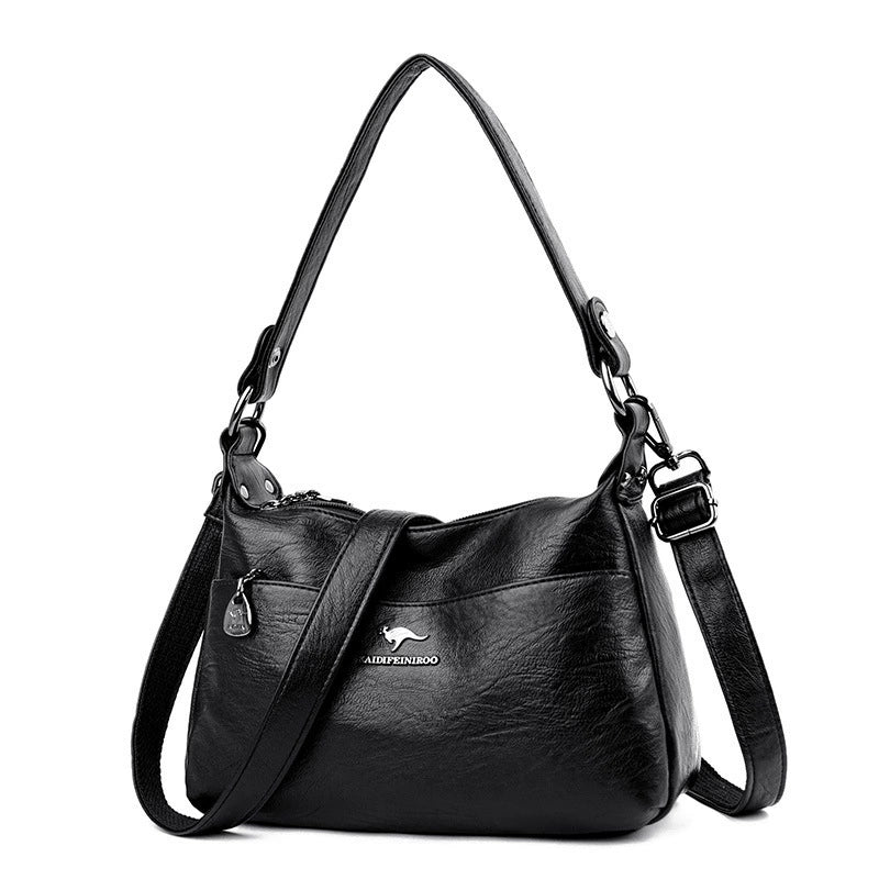 Black handbag with a visible brand logo on a white background
