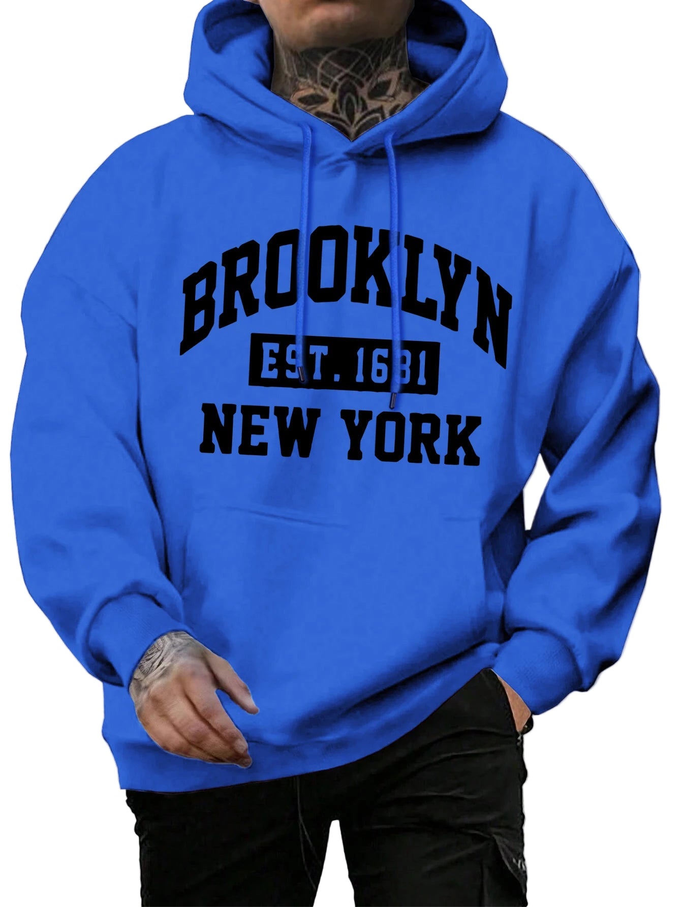 Person wearing a blue hoodie with 'Brooklyn Est. 1683 New York' text on a street.