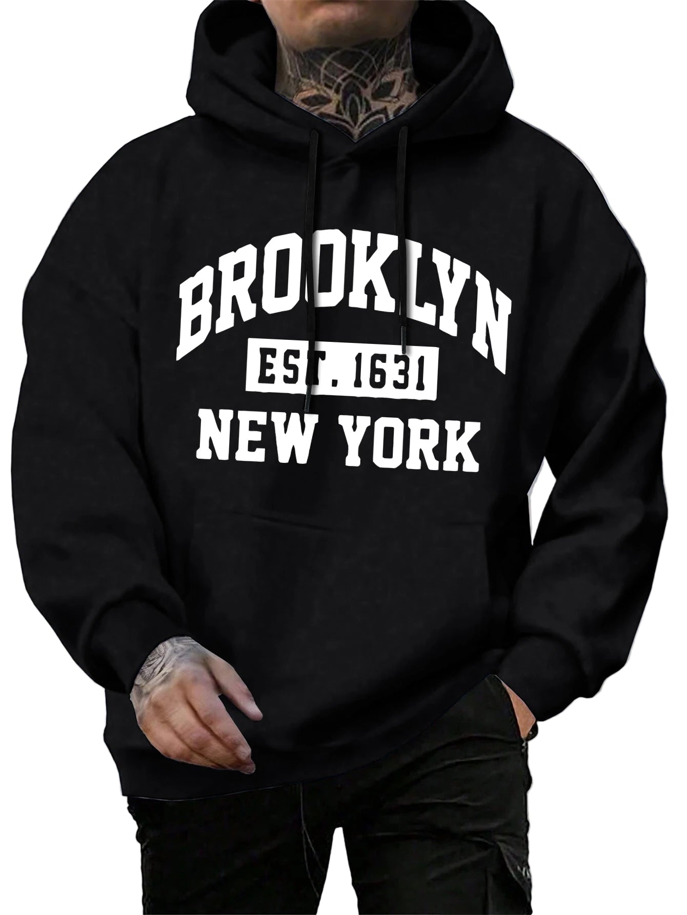 Black hoodie with 'Brooklyn Est. 1631 New York' text worn by a person on a street.