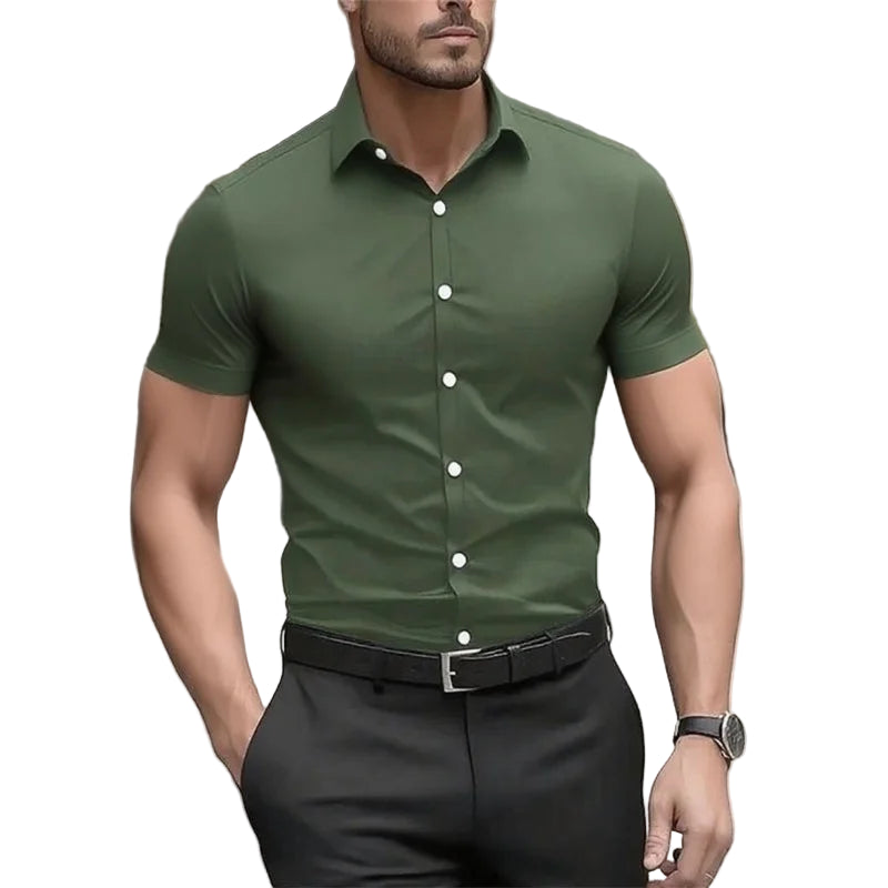 Man wearing a green short-sleeve shirt with a blurred background
