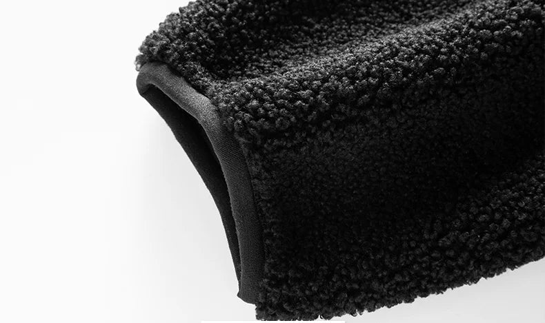 Close-up of a black fleece sleeve on a white background