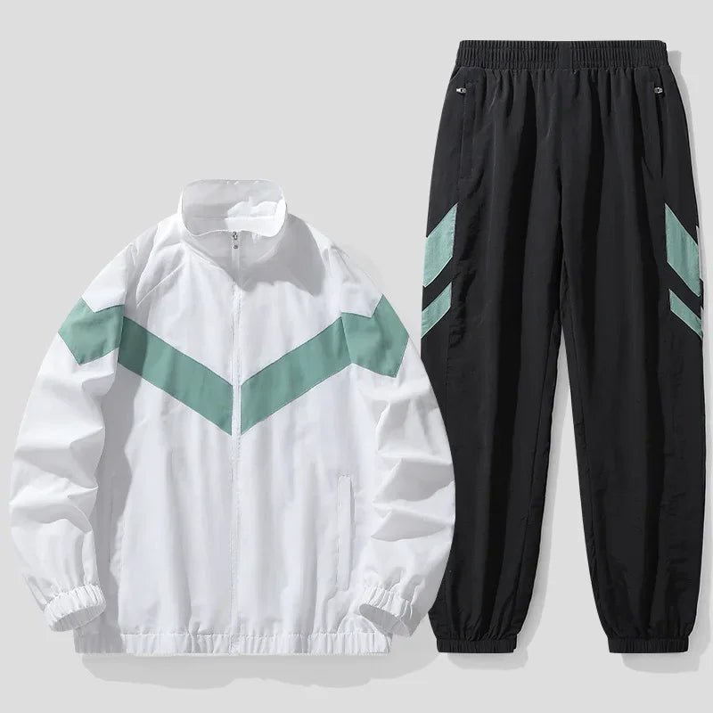 White jacket with green accents and black pants with green stripes on a light gray background