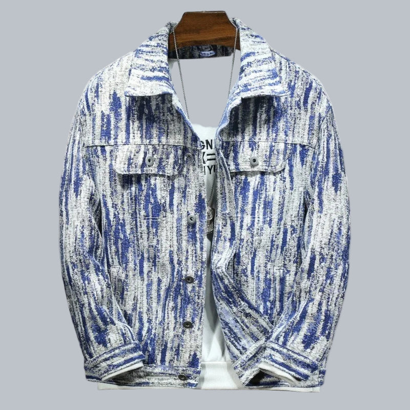 Blue and white patterned jacket on a hanger with a white background