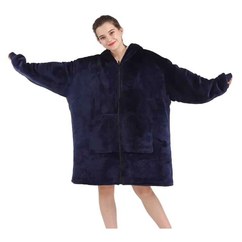 Person wearing a navy blue fleece blanket with zipper on a white background