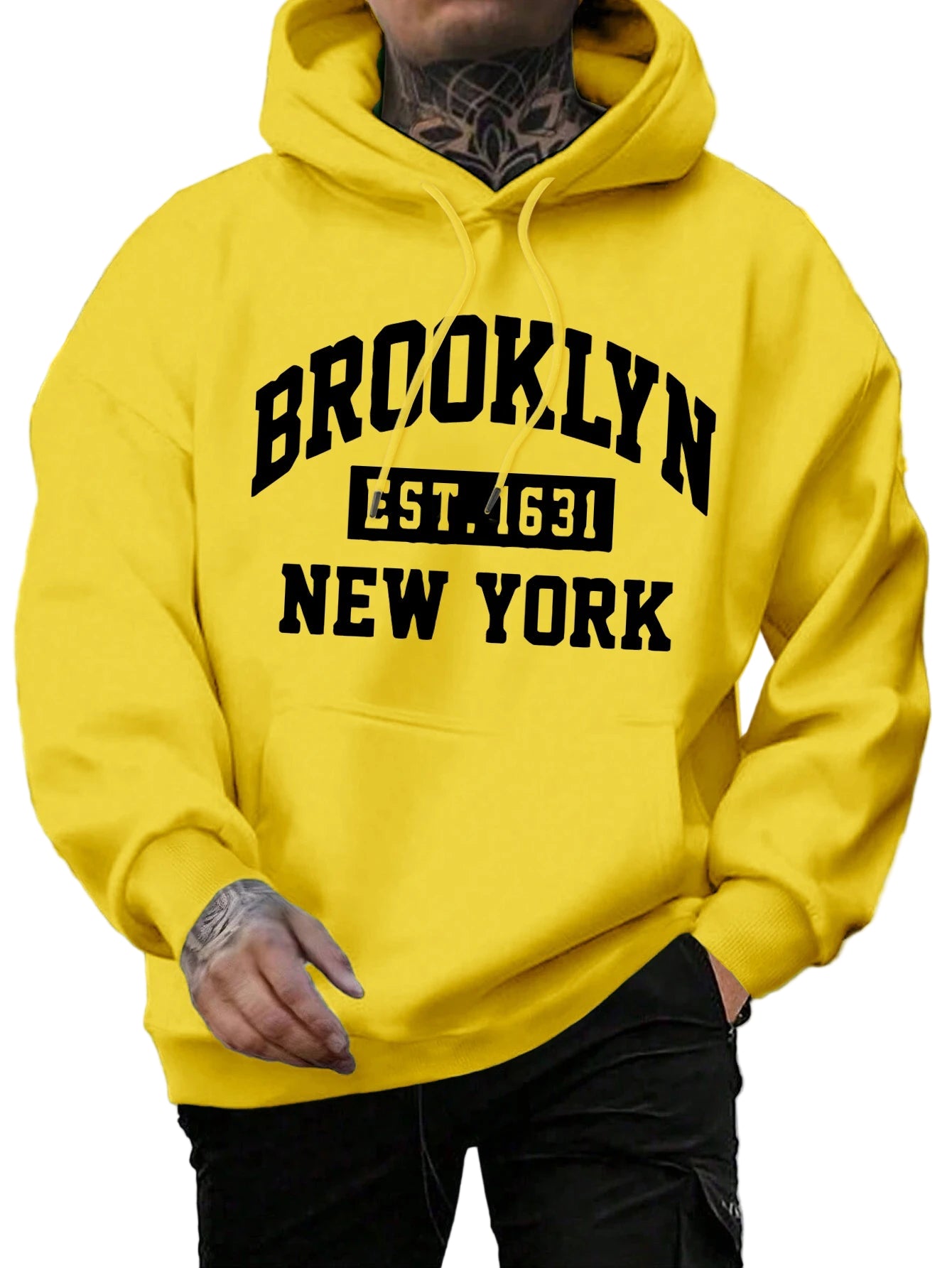 Person wearing a yellow hoodie with 'Brooklyn Est. 1631 New York' text.
