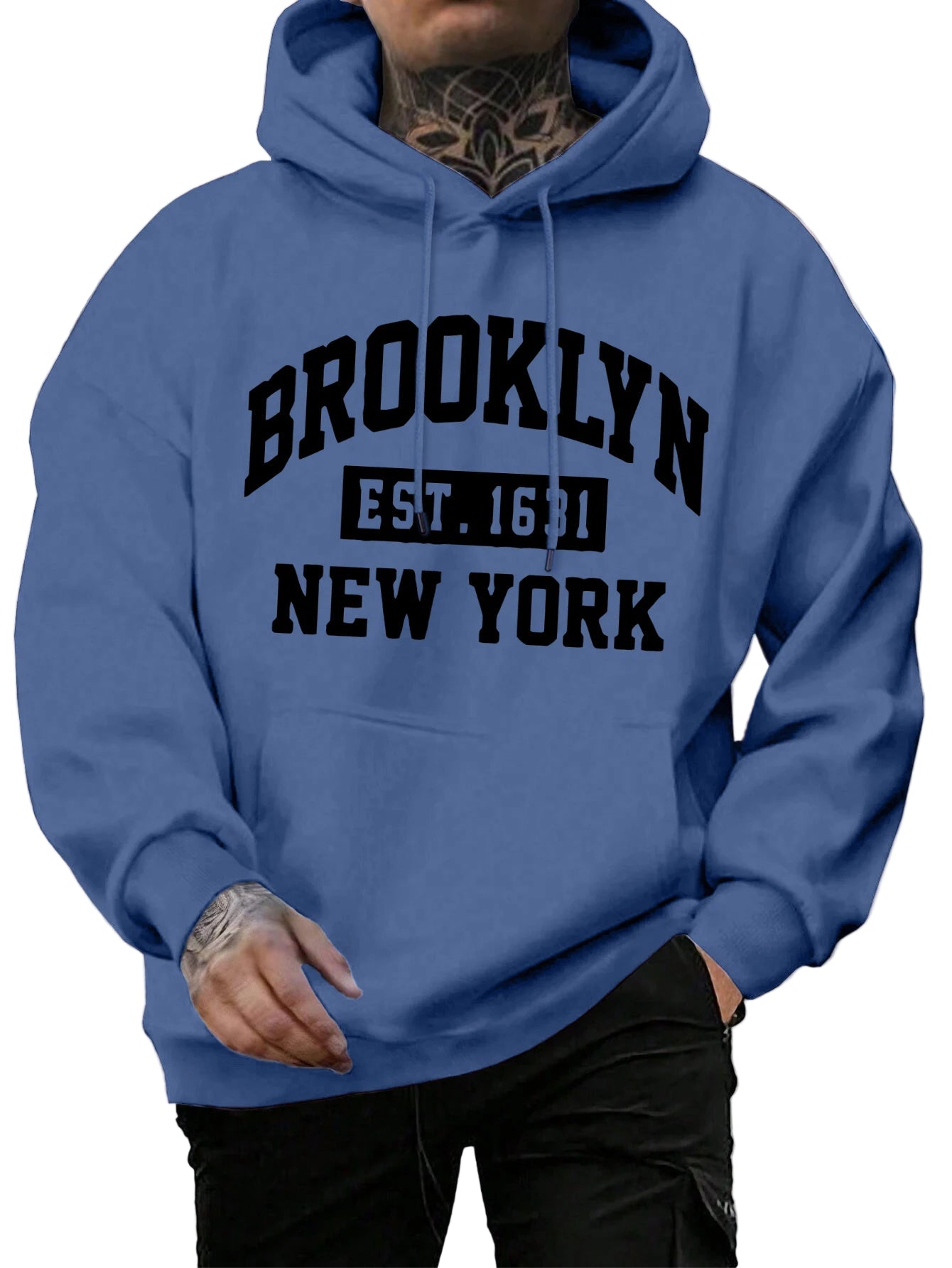 Person wearing a blue hoodie with 'Brooklyn Est. 1683 New York' text on a street background