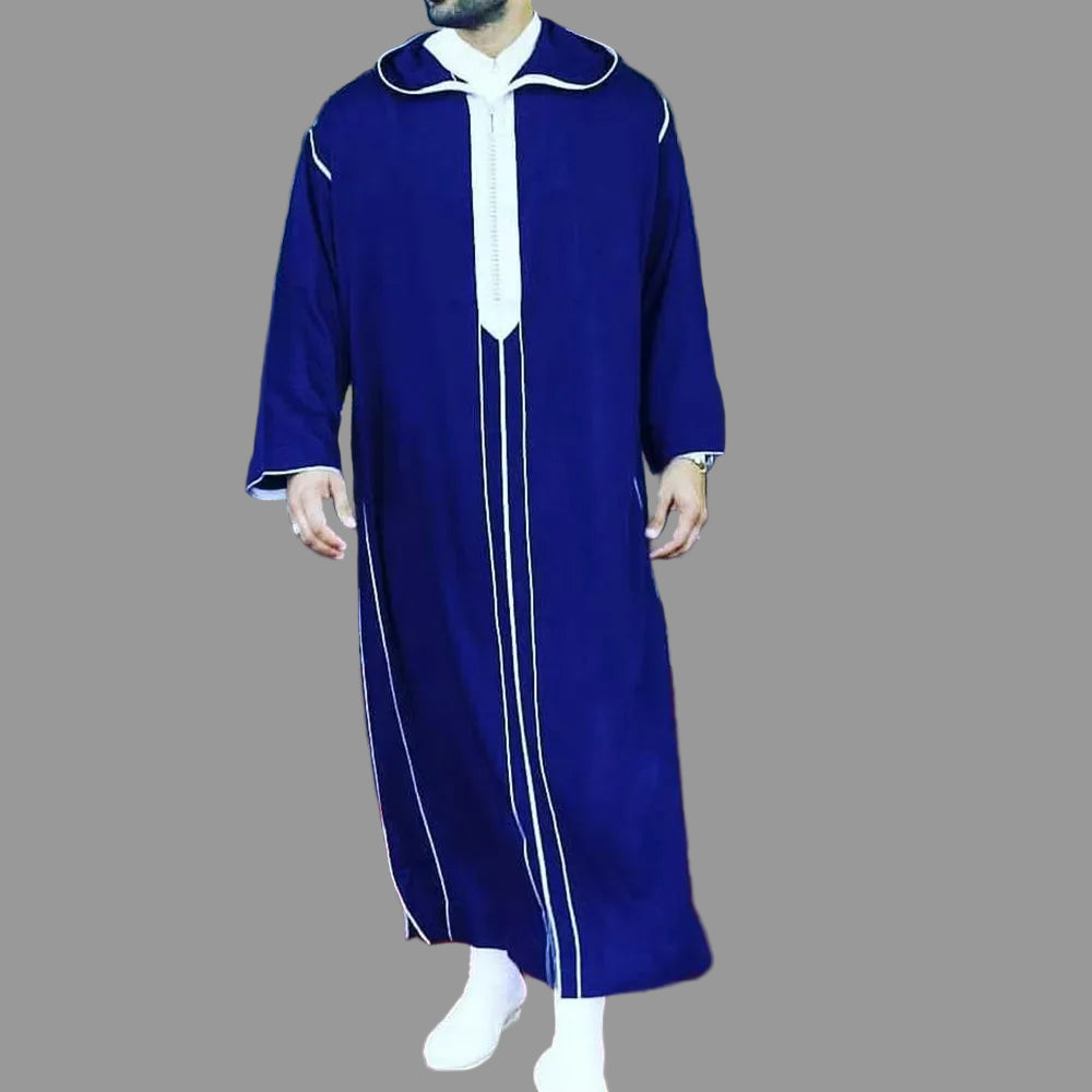 Person wearing a blue and white traditional outfit on a red carpet