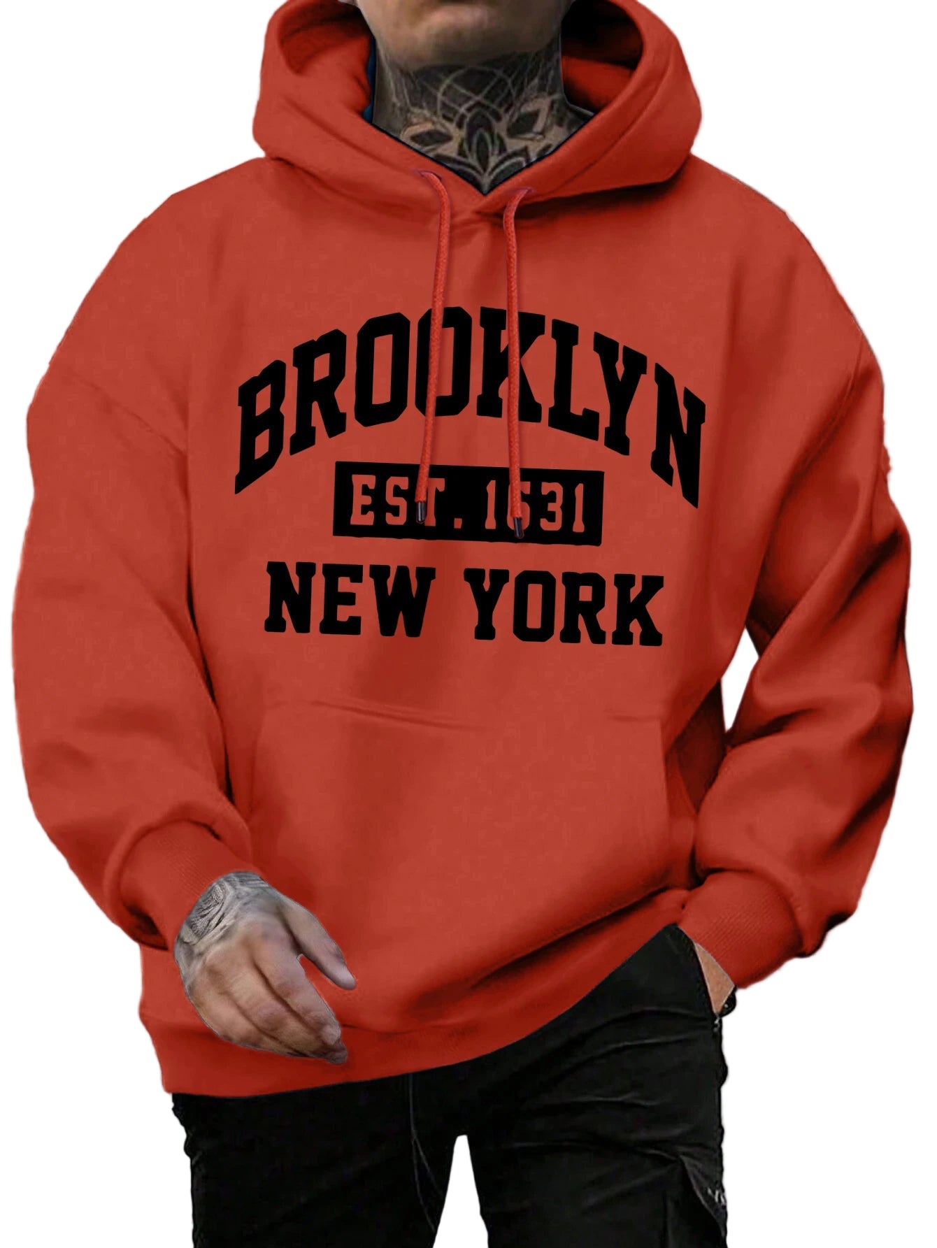 Red hoodie with 'Brooklyn Est. 1531 New York' text worn by a person outdoors.