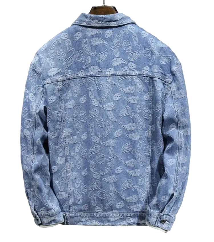 Blue denim jacket with paisley pattern on a gray background