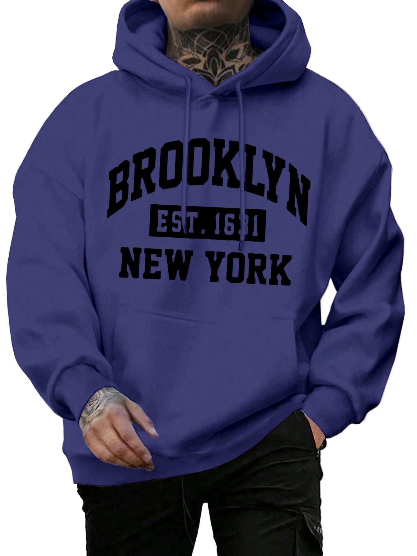 Person wearing a blue hoodie with 'Brooklyn Est. 1651 New York' text on a street background