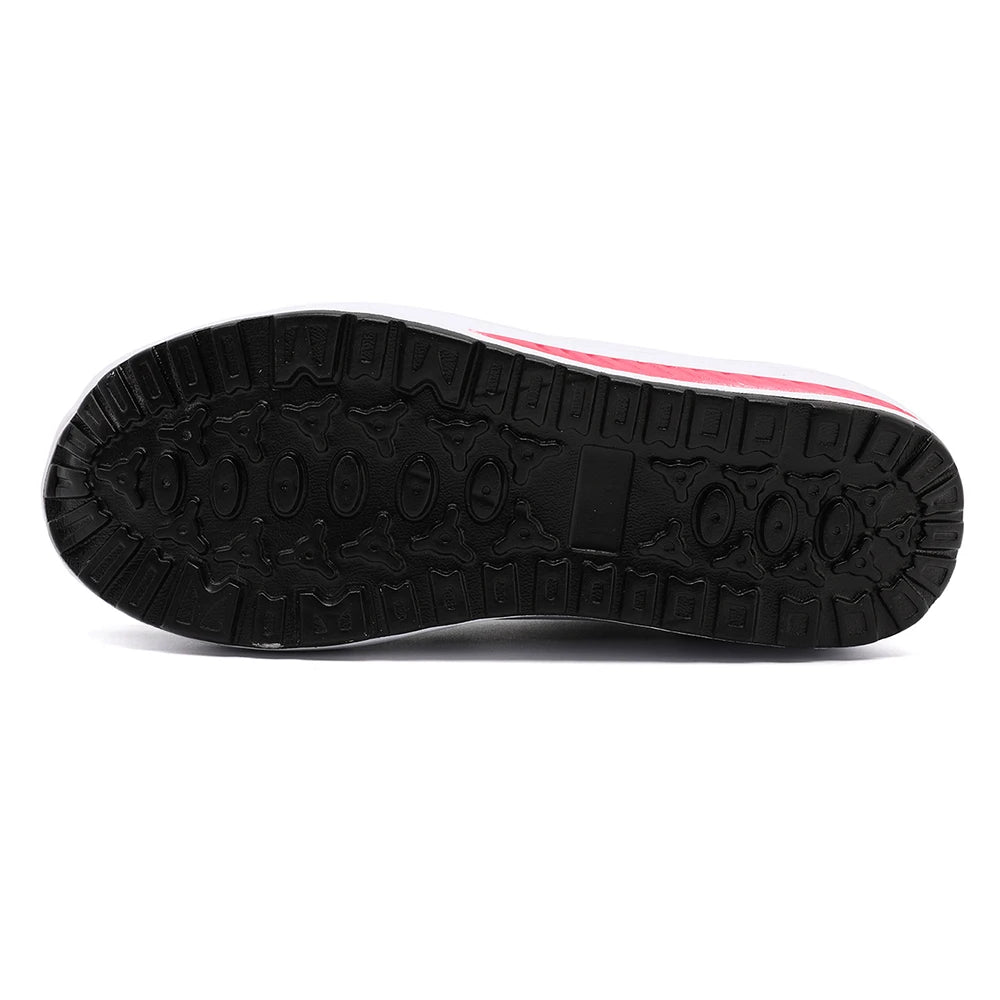 Black sole of a shoe with a white and pink stripe on a white background