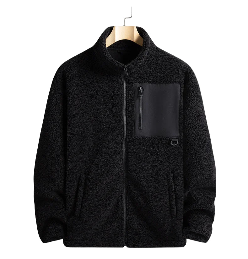 Black jacket with a pocket on a hanger against a white background