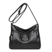Black handbag with a visible brand logo on a white background