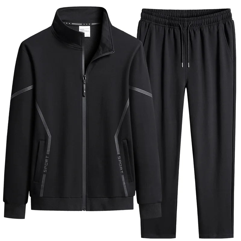 Black tracksuit with zipped jacket and jogger pants on a white background