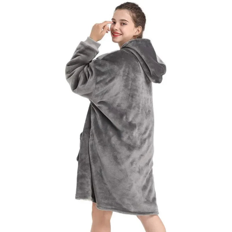 Woman wearing a gray robe with a hood on a white background