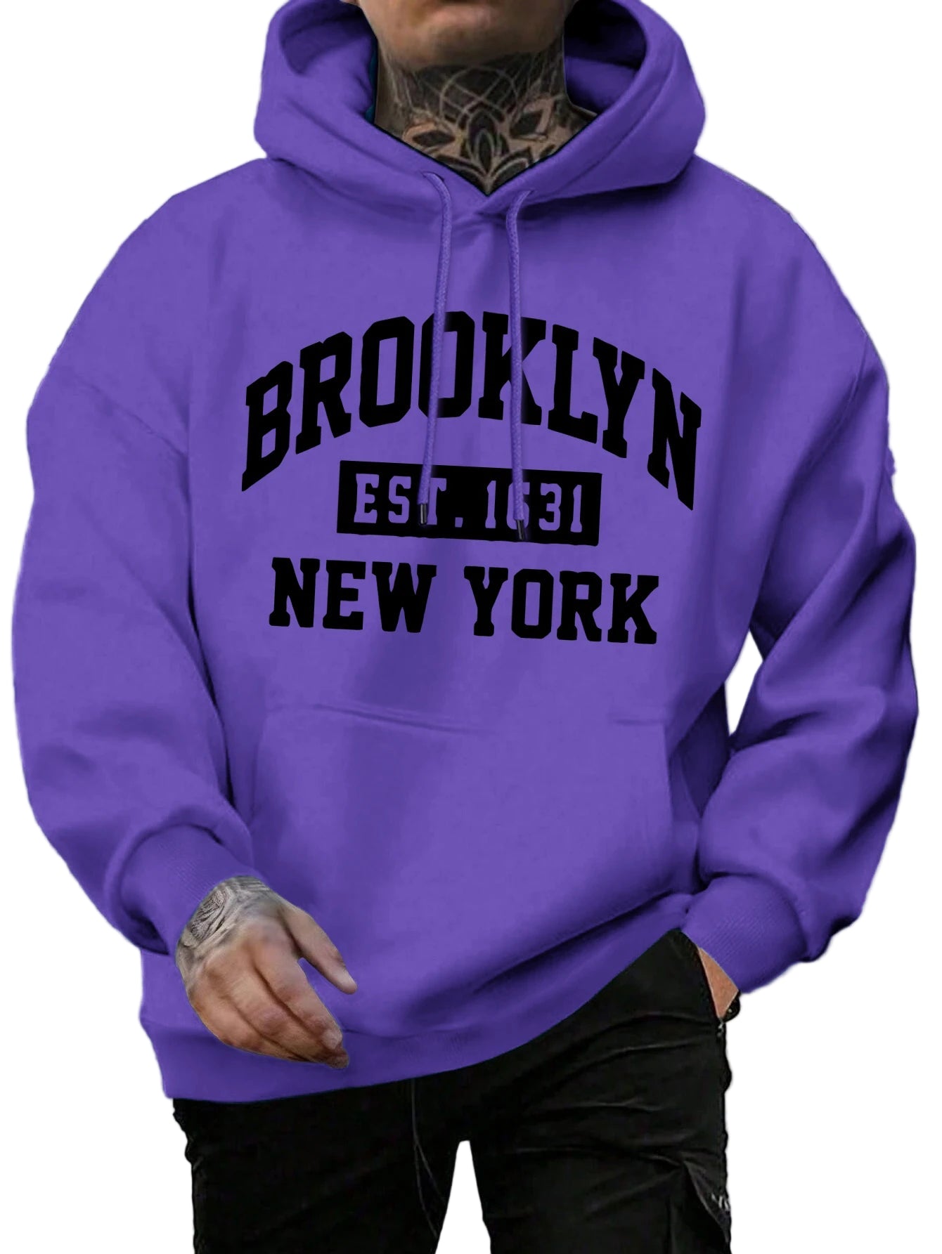 Person wearing a purple hoodie with 'Brooklyn Est. 1831 New York' text on a street background