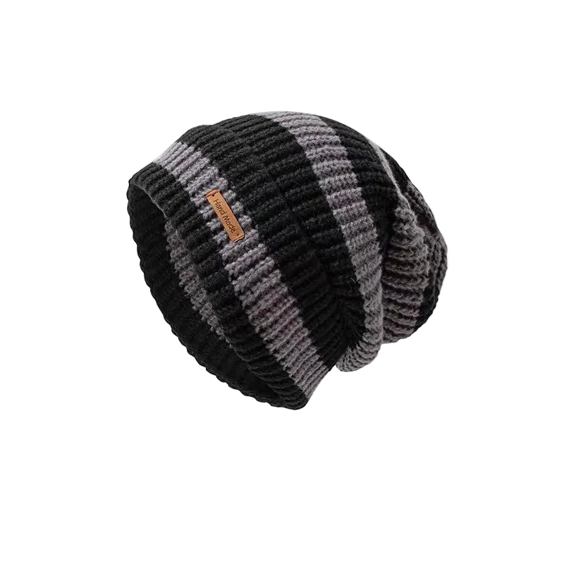 Knitted beanie with a brand label on a white background