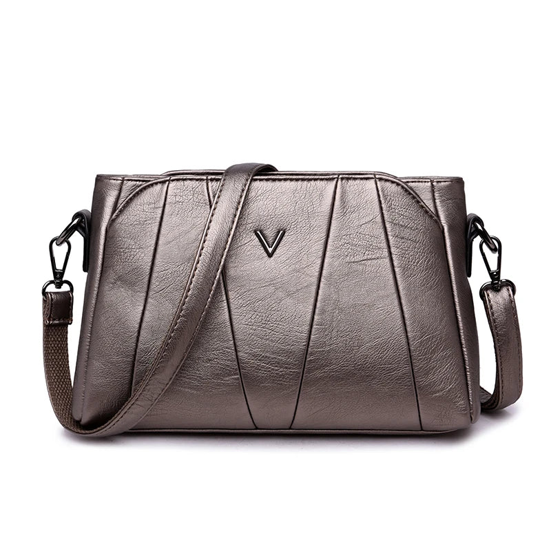 Silver handbag with a brand logo on a white background