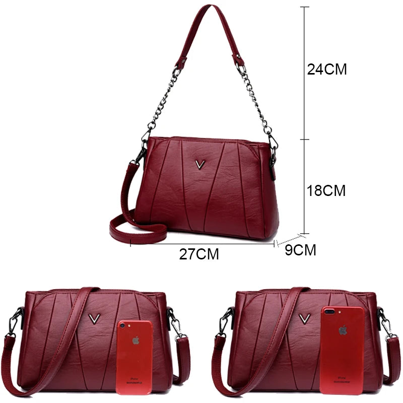 Red handbag with measurements and a phone for scale on a white background