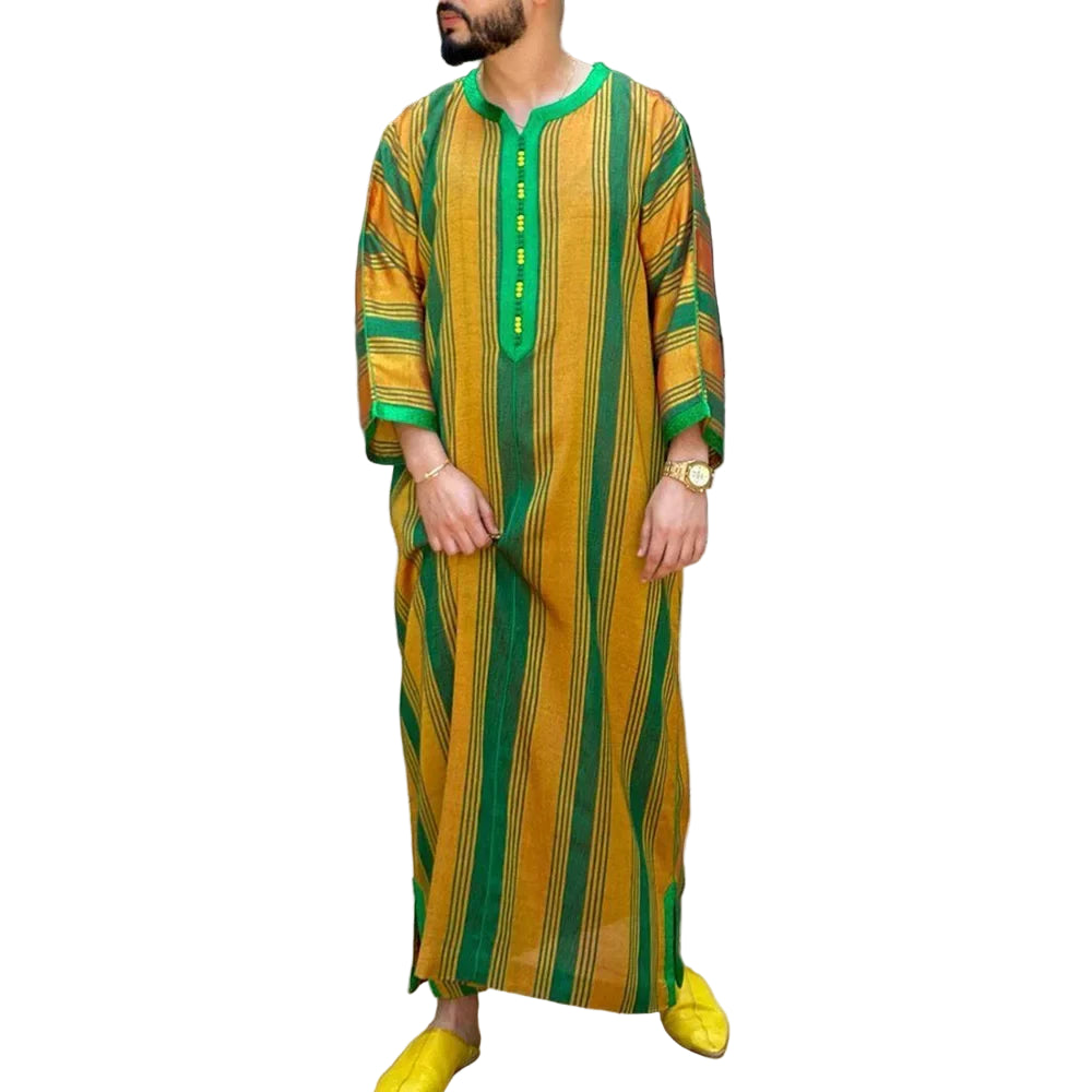 Person wearing a yellow and green striped outfit with plants in the background