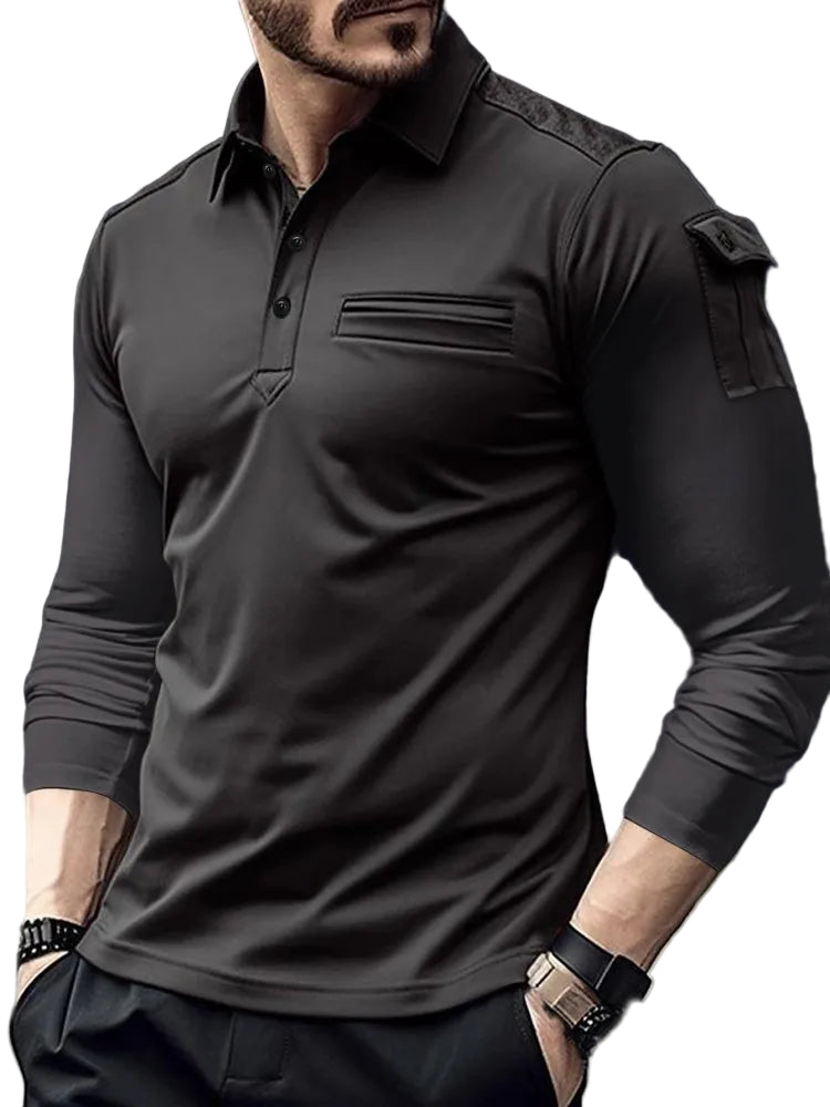 Man wearing a black long-sleeve shirt with tactical design elements.