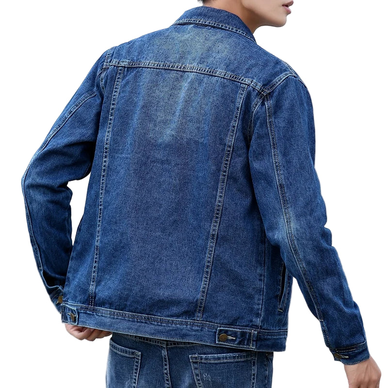 Person wearing a blue denim jacket with a blurred background