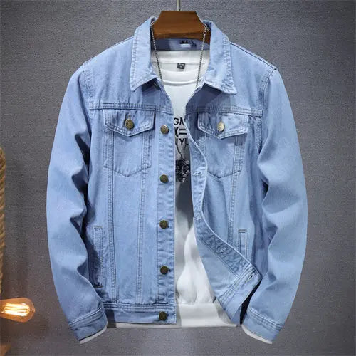 Light blue denim jacket on a gray background