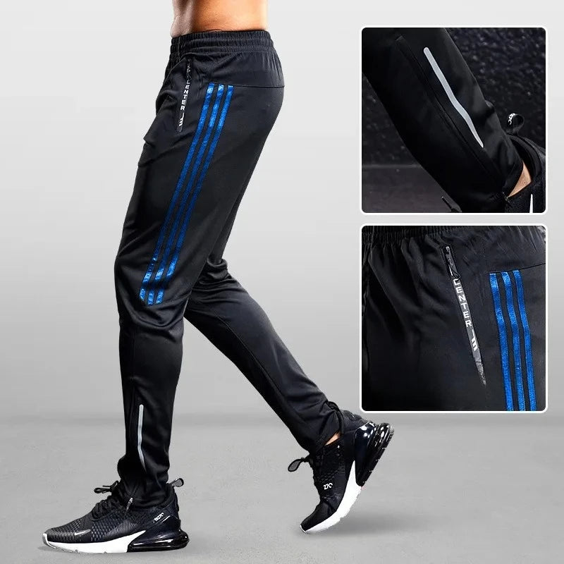 Black athletic pants with blue stripes and white accents on a gray background