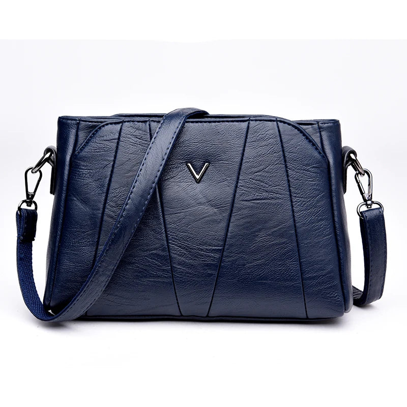 Blue leather handbag with a brand logo on a white background