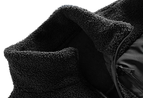 Close-up of black fleece material with text on a white background