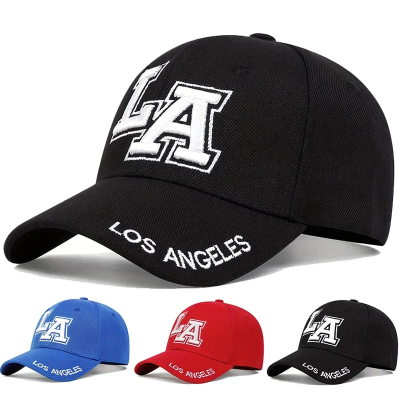 Black cap with 'LA' and 'Los Angeles' text, surrounded by four other caps in blue, red, and black.