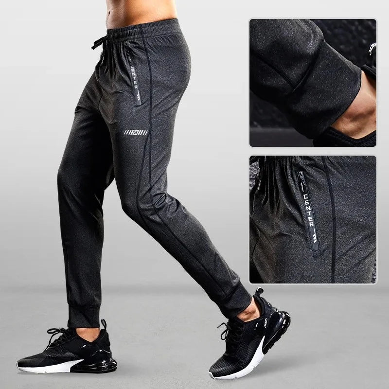 Black athletic pants with a close-up of the fabric texture on a gray background
