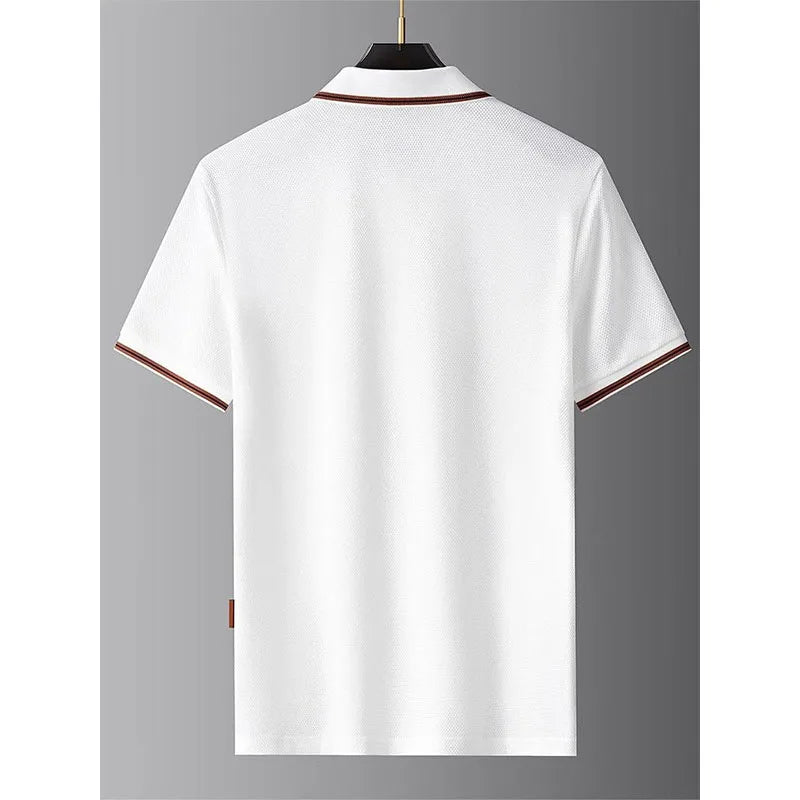 White polo shirt with brown trim on a gray background