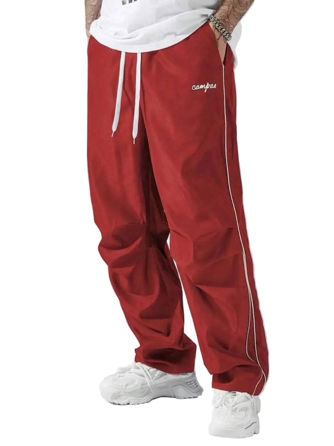 Red track pants with white drawstring and piping on a gray background