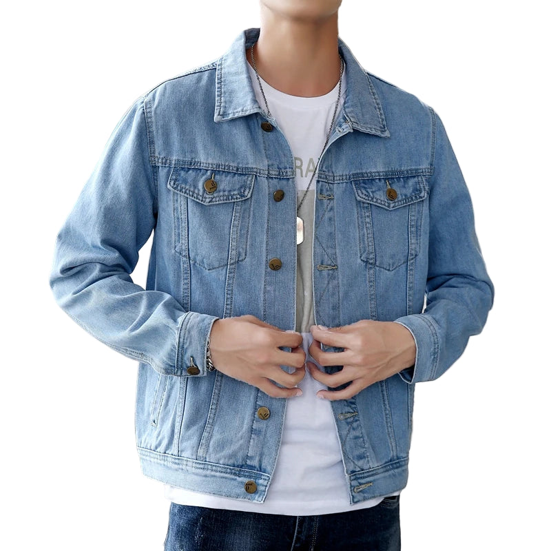 Person wearing a blue denim jacket indoors with a blurred background