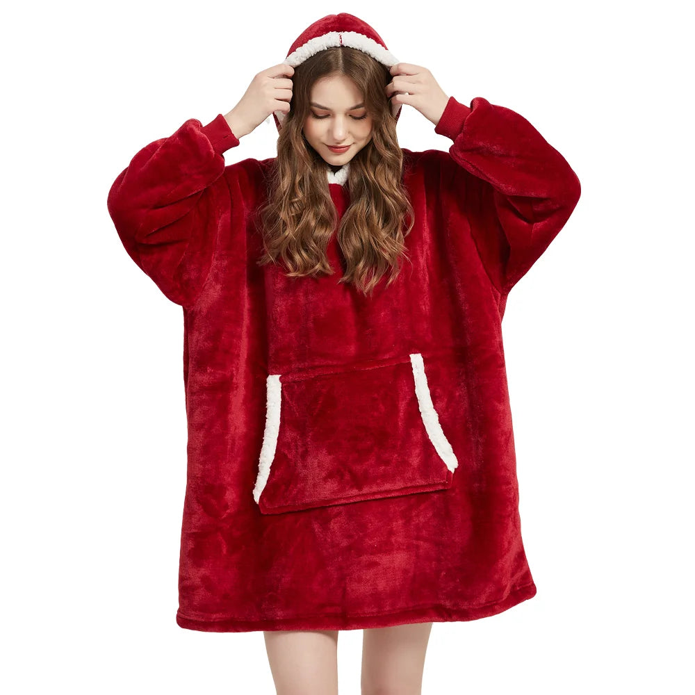 Person wearing a red fleece blanket with hood on a white background