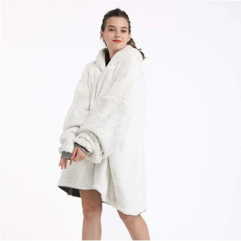 Woman wearing a white fleece blanket with gray trim on a white background