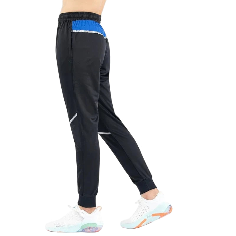 Black pants with blue and white accents on a white background