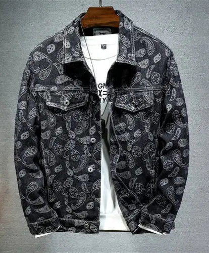 Black paisley patterned jacket on a gray background