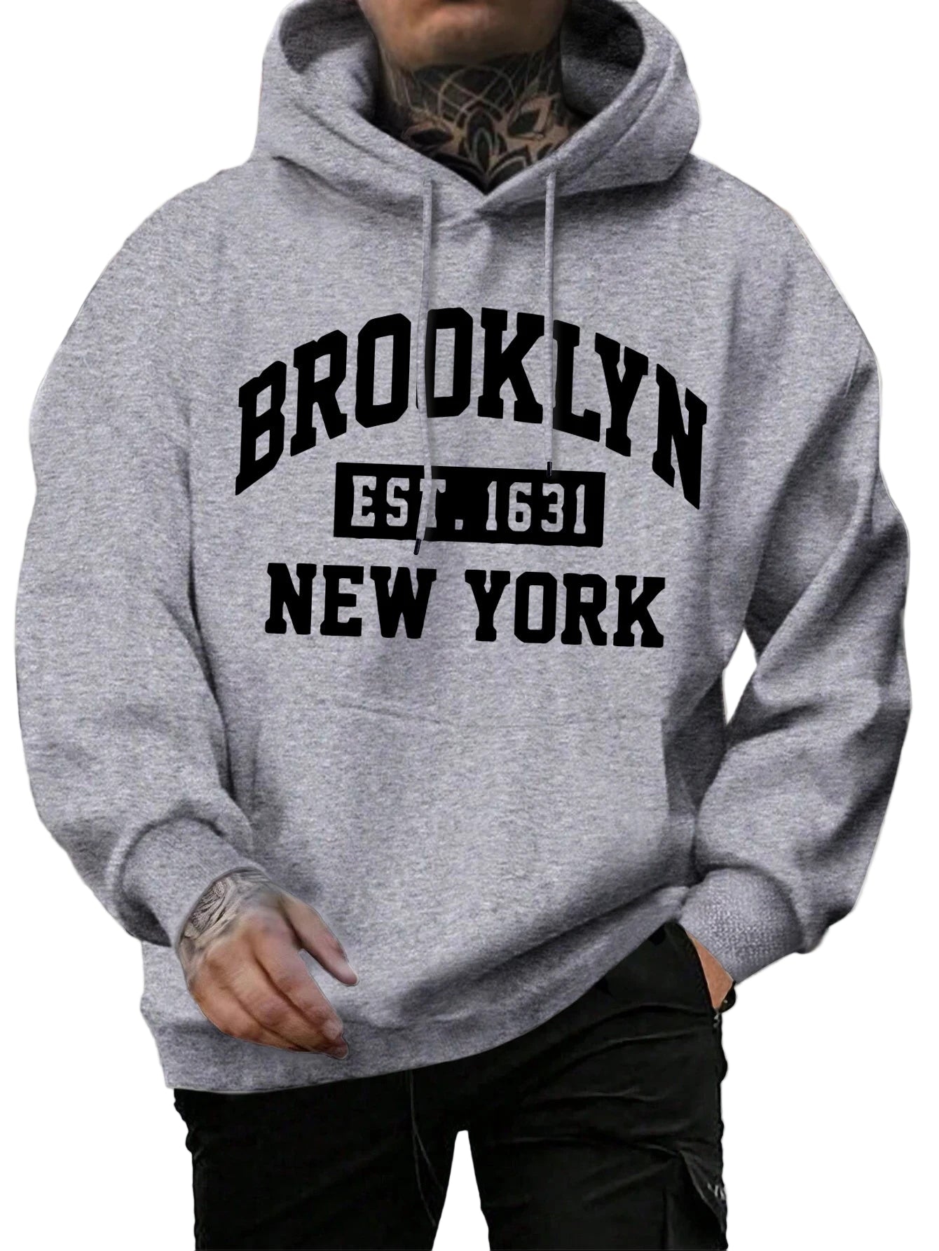 Person wearing a gray hoodie with 'Brooklyn Est. 1631 New York' text.