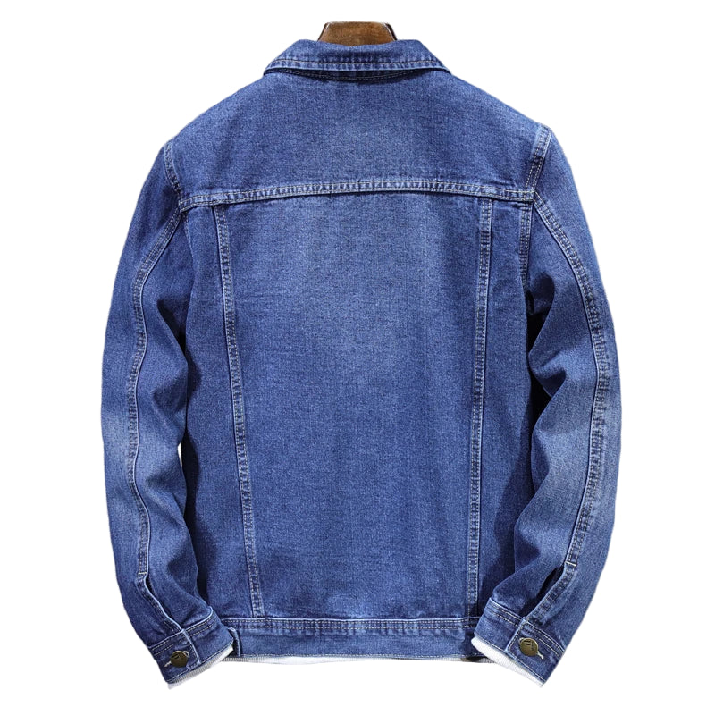 Blue denim jacket on a gray background