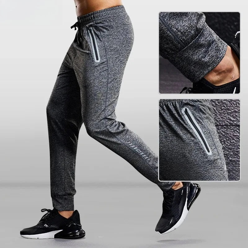 Gray jogger pants with drawstring and side pocket on a gray background